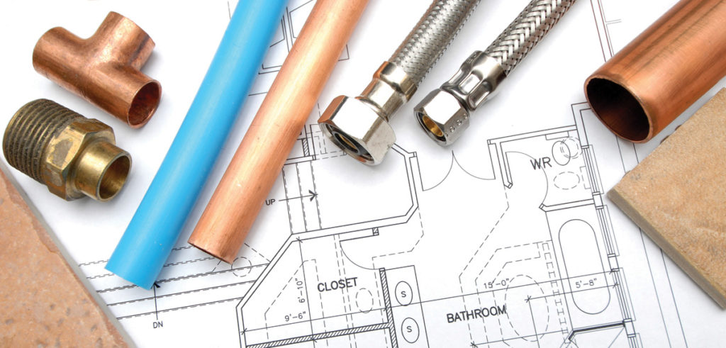 plumbing components on top of blueprint